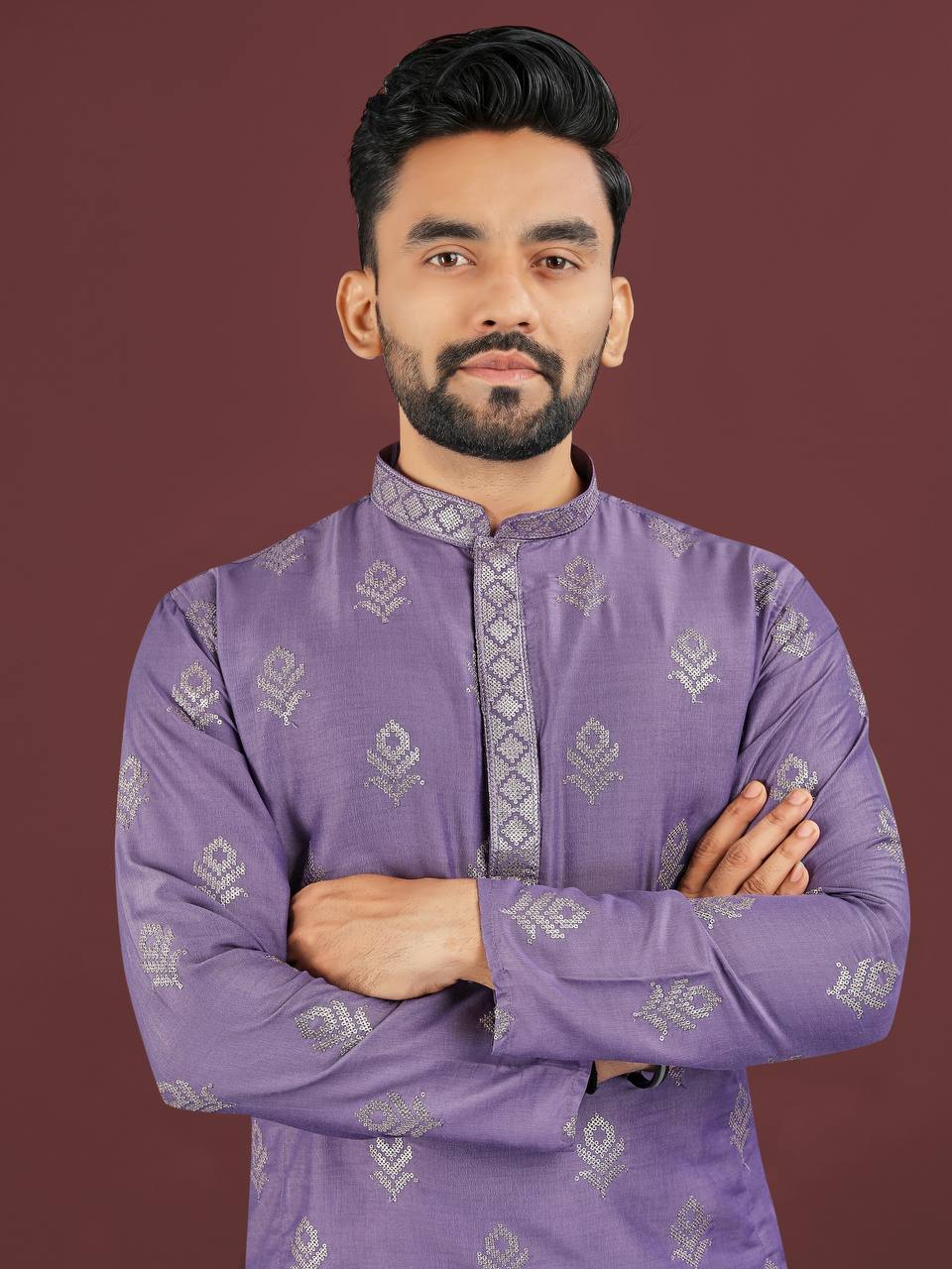 Man wearing lavender jacquard kurta set with intricate silver floral patterns and mandarin collar