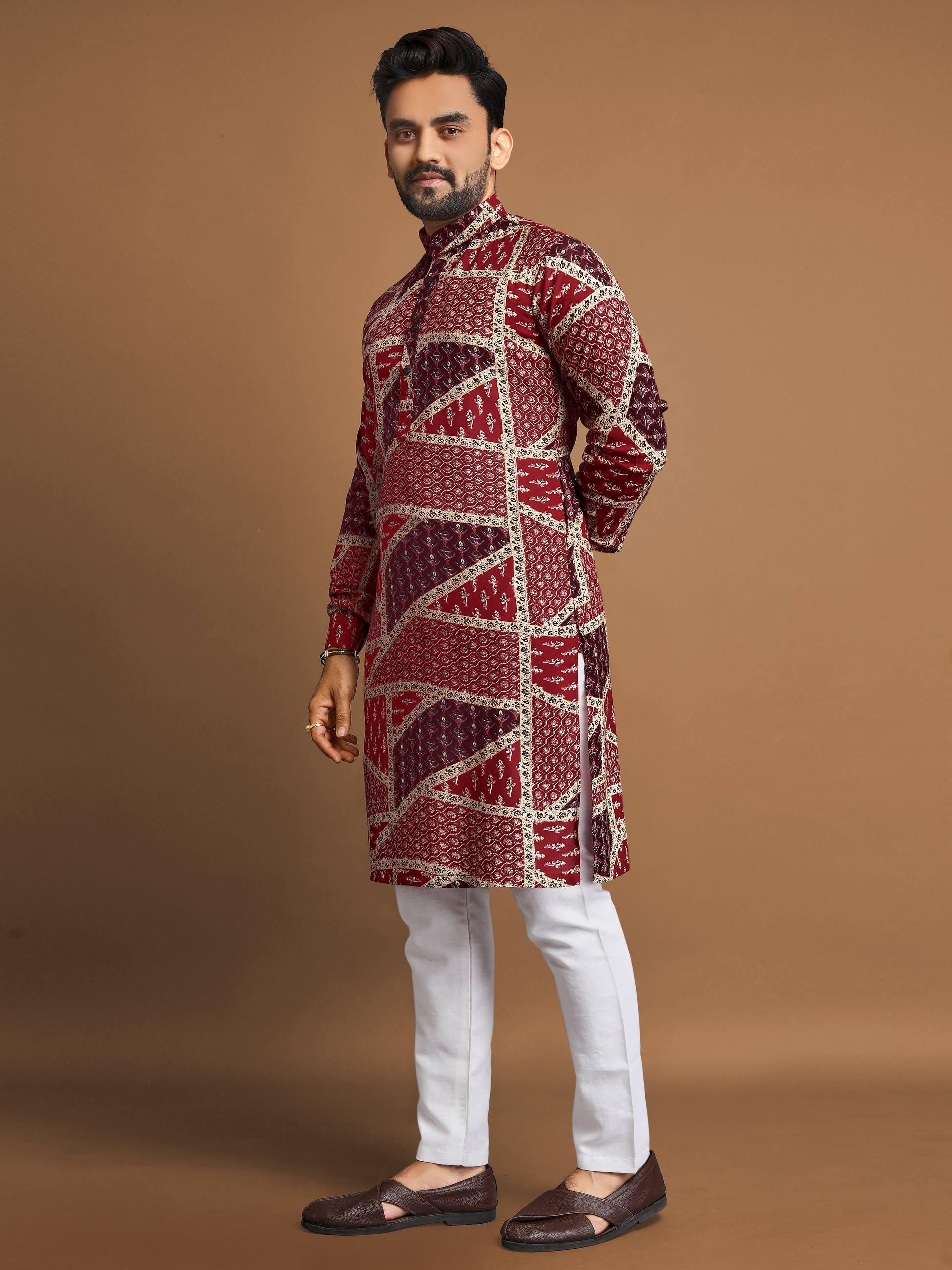 Man wearing a men's cotton foil print kurta in maroon and white geometric design paired with white pants