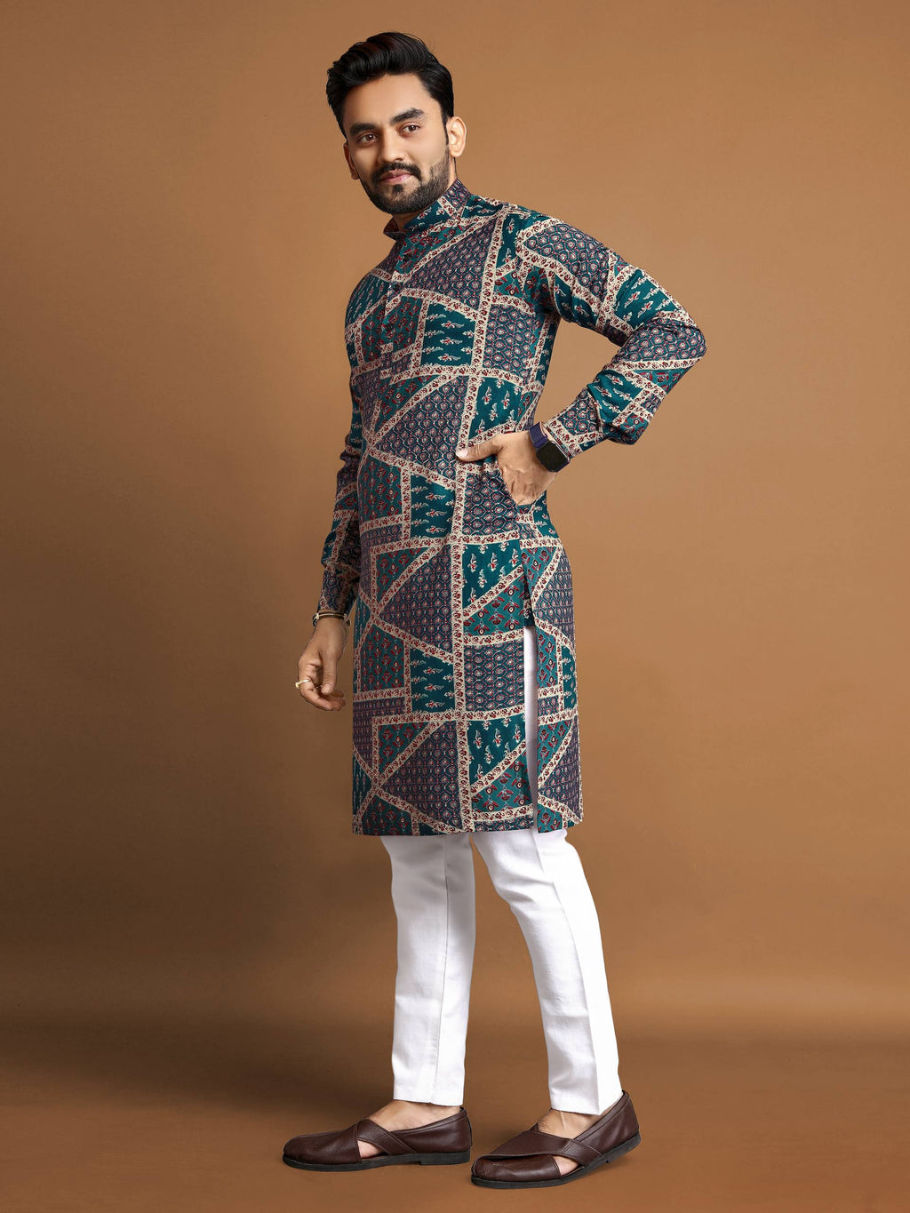 Man wearing a men's cotton foil print kurta with geometric patterns paired with white pants and brown shoes