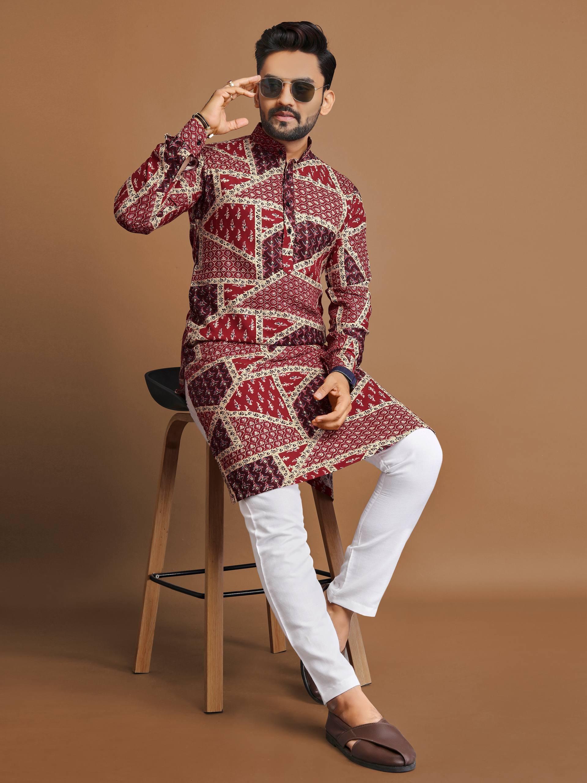 Man wearing a men's cotton foil print kurta with geometric patterns paired with white pants and sunglasses