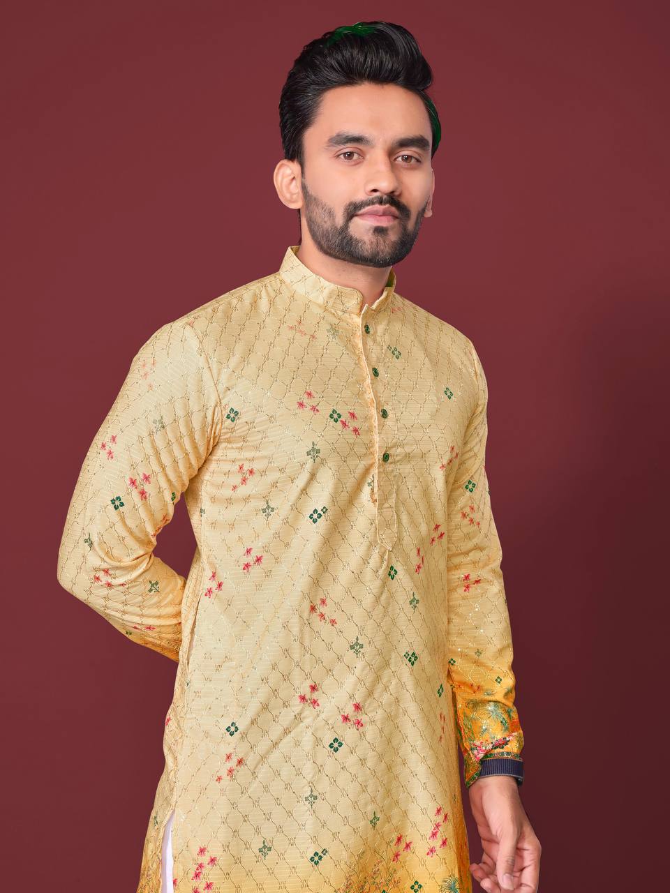 Pehrang yellow embroidered kurta with floral designs worn by man against maroon background