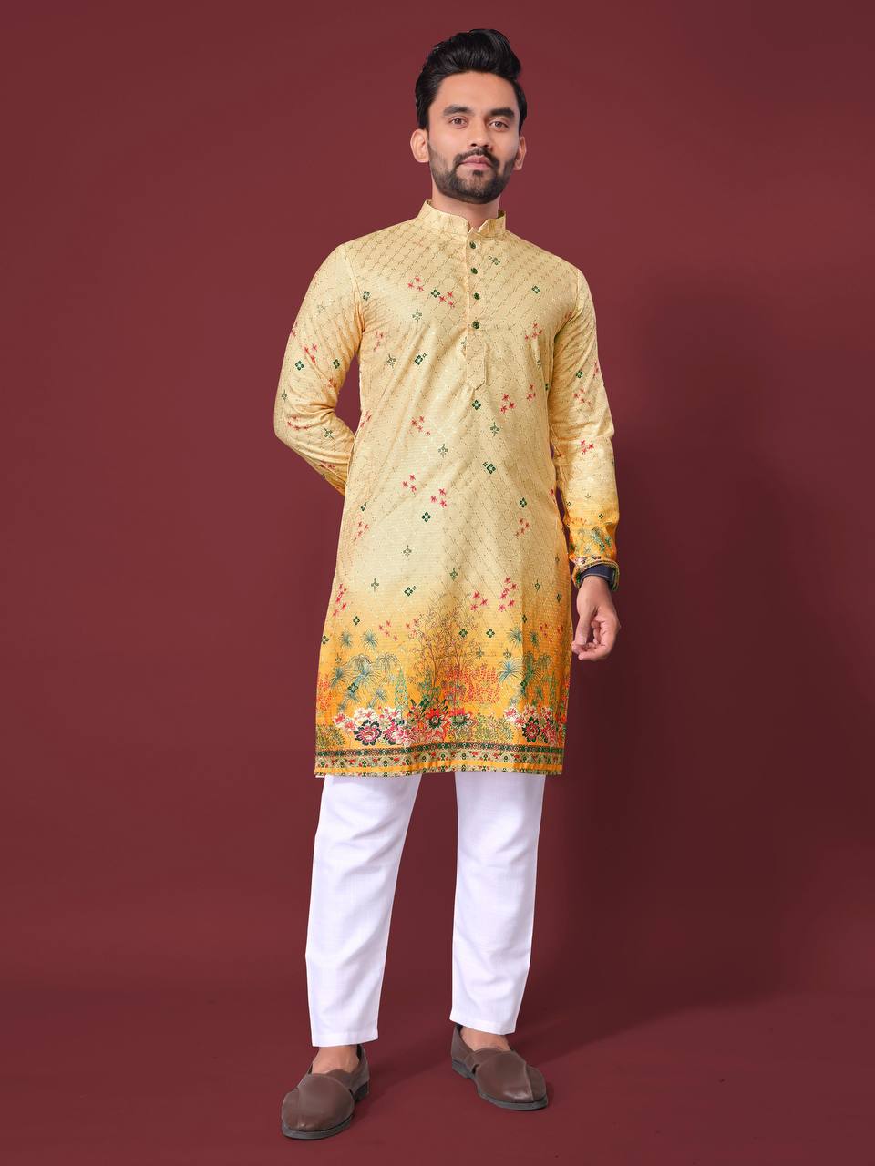 Pehrang yellow embroidered kurta with floral patterns worn with white pants and brown shoes