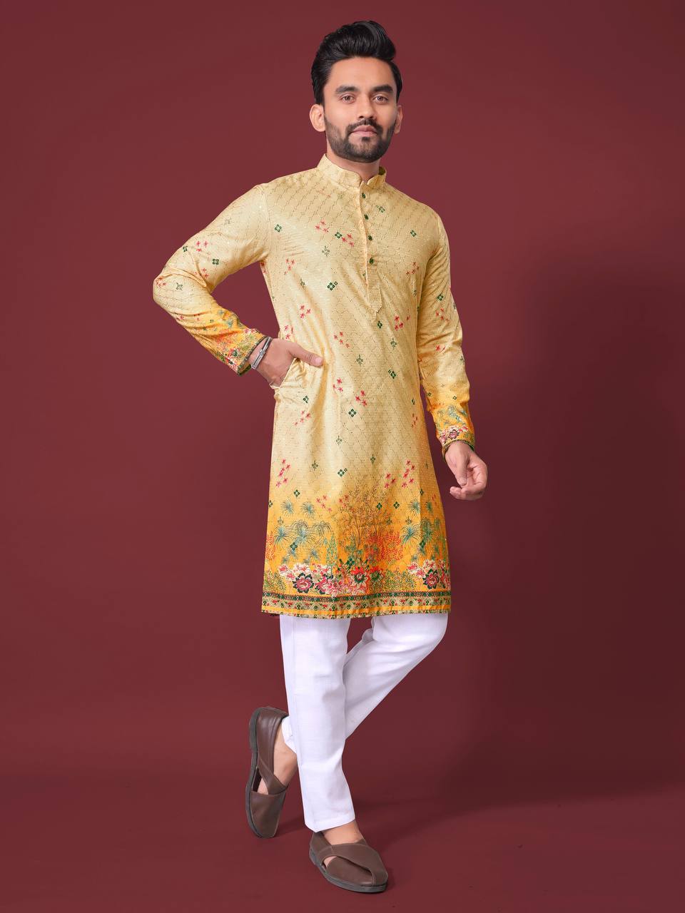 Pehrang yellow embroidered kurta with floral patterns worn with white pants and brown shoes